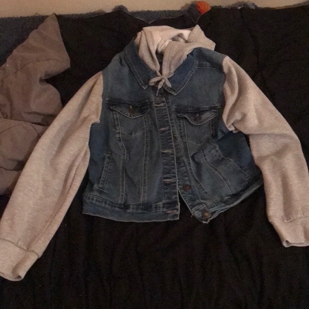 a jean jacket with a fluffy sleeve and hood from wax jean